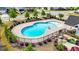 Aerial view of a community pool featuring clean, blue water and a secure fence at 316 Barley Mill Rd, Holly Springs, NC 27540