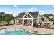 Community pool with lounge chairs, patio, and covered area at 316 Barley Mill Rd, Holly Springs, NC 27540