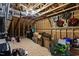 Unfinished attic with exposed rafters filled with storage boxes and seasonal decor at 3248 Castlerock Dr, Burlington, NC 27215