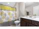 Bathroom featuring a wood vanity with white countertop and patterned shower curtain at 3248 Castlerock Dr, Burlington, NC 27215