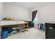 Neutral bedroom featuring a loft bed with storage, dark dresser and a window at 3248 Castlerock Dr, Burlington, NC 27215