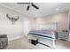 Bedroom with neutral walls, carpeted floor, and a white wood bed frame and side table at 3248 Castlerock Dr, Burlington, NC 27215
