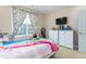 Bedroom featuring carpeted floors, bright bedding, and natural light at 3248 Castlerock Dr, Burlington, NC 27215