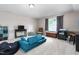Bonus room with neutral walls, carpeted floor, comfortable sofa, and natural light at 3248 Castlerock Dr, Burlington, NC 27215