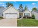 Beautiful one-story home showcasing a two-car garage, tidy landscaping, and inviting architecture at 3248 Castlerock Dr, Burlington, NC 27215