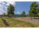 Community playground with slides, swings, and climbing structures surrounded by mature trees at 3248 Castlerock Dr, Burlington, NC 27215