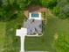 Aerial view of home with a private backyard swimming pool surrounded by lush landscaping at 325 Forest Bridge Rd, Youngsville, NC 27596