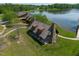 Scenic aerial view of a lakeside community pavilion featuring stone accents and manicured lawns at 325 Forest Bridge Rd, Youngsville, NC 27596