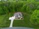 Aerial view of a home featuring an in-ground pool and beautiful landscaping, nestled in a lush, green setting at 325 Forest Bridge Rd, Youngsville, NC 27596