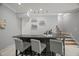 Basement wet bar with overhead lighting and seating for three at 325 Forest Bridge Rd, Youngsville, NC 27596