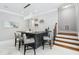 Finished basement with a bar, seating and stairs to upper level at 325 Forest Bridge Rd, Youngsville, NC 27596