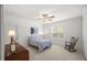 Inviting bedroom with natural light, ceiling fan, and striped bedding at 325 Forest Bridge Rd, Youngsville, NC 27596