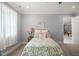 Inviting bedroom with neutral carpeting, a comfy bed, and soft natural light at 325 Forest Bridge Rd, Youngsville, NC 27596