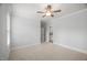 This cozy bedroom offers neutral carpeting and a glimpse into an adjacent bathroom at 325 Forest Bridge Rd, Youngsville, NC 27596
