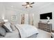 This bedroom features a ceiling fan, television, and ensuite bath at 325 Forest Bridge Rd, Youngsville, NC 27596