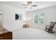 Bright bedroom with neutral carpet, a ceiling fan, and a window that offers lots of natural light at 325 Forest Bridge Rd, Youngsville, NC 27596