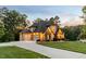Beautiful new construction home boasts a three car garage, lovely lawn, and pristine driveway at 325 Forest Bridge Rd, Youngsville, NC 27596