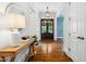 Inviting foyer showcasing hardwood floors, elegant lighting, and beautiful doors at 325 Forest Bridge Rd, Youngsville, NC 27596