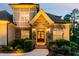 Charming home featuring a stone and siding exterior with a meticulously landscaped front entrance at 325 Forest Bridge Rd, Youngsville, NC 27596