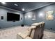 Home theater room with large screen TV and reclining seating at 325 Forest Bridge Rd, Youngsville, NC 27596