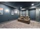 Home theater with plush seating and movie posters for an immersive experience at 325 Forest Bridge Rd, Youngsville, NC 27596