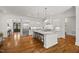 Bright, eat-in kitchen with granite countertops, an island, and stainless steel appliances at 325 Forest Bridge Rd, Youngsville, NC 27596