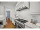 Gourmet kitchen with stainless appliances, granite countertops, custom cabinetry, and tile backsplash at 325 Forest Bridge Rd, Youngsville, NC 27596