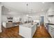 Modern kitchen with stainless steel appliances and granite countertops in an open layout at 325 Forest Bridge Rd, Youngsville, NC 27596