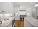 Gourmet kitchen featuring granite countertops, stainless steel appliances, and white cabinetry at 325 Forest Bridge Rd, Youngsville, NC 27596