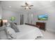Spacious main bedroom features a ceiling fan and a mounted television at 325 Forest Bridge Rd, Youngsville, NC 27596