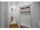 Mudroom features a built-in bench with storage and hooks for organization at 325 Forest Bridge Rd, Youngsville, NC 27596