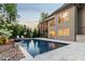 Well-manicured backyard with inground pool and covered patio for entertaining at 325 Forest Bridge Rd, Youngsville, NC 27596