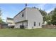 Spacious backyard with lush lawn, mature trees, and well-maintained vinyl siding of the home at 3613 Ranbir Dr, Durham, NC 27713