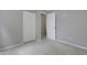 Cozy bedroom featuring neutral walls, plush carpeting, and a convenient closet for ample storage at 3613 Ranbir Dr, Durham, NC 27713