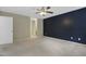 Spacious bedroom featuring neutral walls, plush carpet, and stylish ceiling fan fixture at 3613 Ranbir Dr, Durham, NC 27713