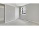 Well-lit bedroom with neutral walls, soft carpeting, and a closet for storage at 3613 Ranbir Dr, Durham, NC 27713