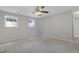 Bright bedroom with neutral walls, plush carpet, and a view of the windows at 3613 Ranbir Dr, Durham, NC 27713