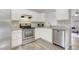Modern kitchen featuring white cabinets, stainless steel appliances, and granite countertops at 3613 Ranbir Dr, Durham, NC 27713