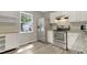 Bright kitchen with white cabinets, stainless steel appliances, and granite countertops at 3613 Ranbir Dr, Durham, NC 27713