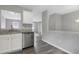 Well-lit kitchen with stainless steel appliances and an open view into the living area at 3613 Ranbir Dr, Durham, NC 27713