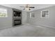 Cozy living room with a stone fireplace, mantle, and a flat-screen TV at 3613 Ranbir Dr, Durham, NC 27713