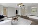 Spacious living room with hardwood floors, neutral walls, and large windows at 3613 Ranbir Dr, Durham, NC 27713