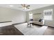 Bright living room featuring hardwood floors, neutral walls, and a cozy seating area at 3613 Ranbir Dr, Durham, NC 27713