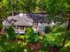 Aerial view of the backyard of a charming home, featuring a deck and screened-in porch at 3804 Nottaway Rd, Durham, NC 27707