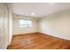 This bedroom has hardwood floors and natural light at 3804 Nottaway Rd, Durham, NC 27707