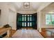 Spacious foyer with hardwood floors, a large rug, and an impressive entrance at 3804 Nottaway Rd, Durham, NC 27707