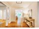 Bright and inviting foyer featuring hardwood floors and elegant console table at 3804 Nottaway Rd, Durham, NC 27707
