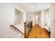 Hallway with hardwood floor and an entrance to a seating room at 3804 Nottaway Rd, Durham, NC 27707