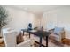 Spacious home office features hardwood floors, a modern desk, and comfortable chairs at 3804 Nottaway Rd, Durham, NC 27707