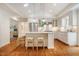 Elegant kitchen with a center island, stainless steel appliances, and bright, airy design at 3804 Nottaway Rd, Durham, NC 27707